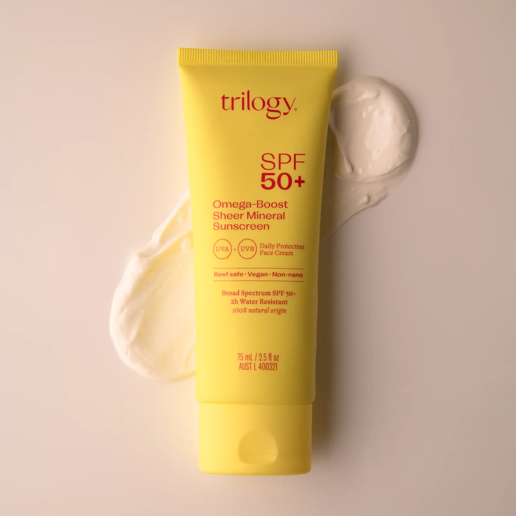 A tube of Trilogy SPF 50+ Omega-Boost Sheer Mineral Sunscreen with a visible creamy sunscreen texture beside it.