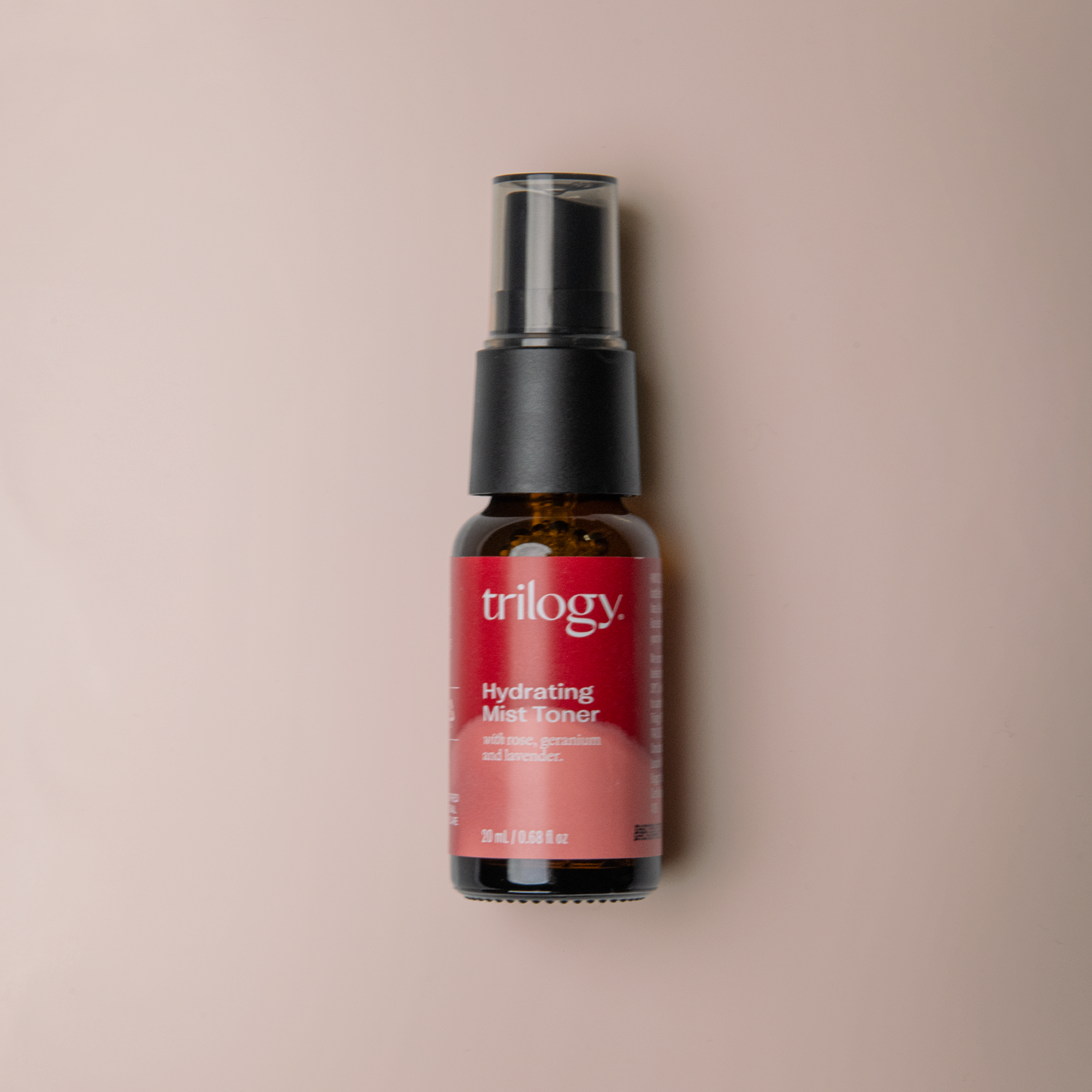 Trilogy hydrating mist toner bottle on a beige background