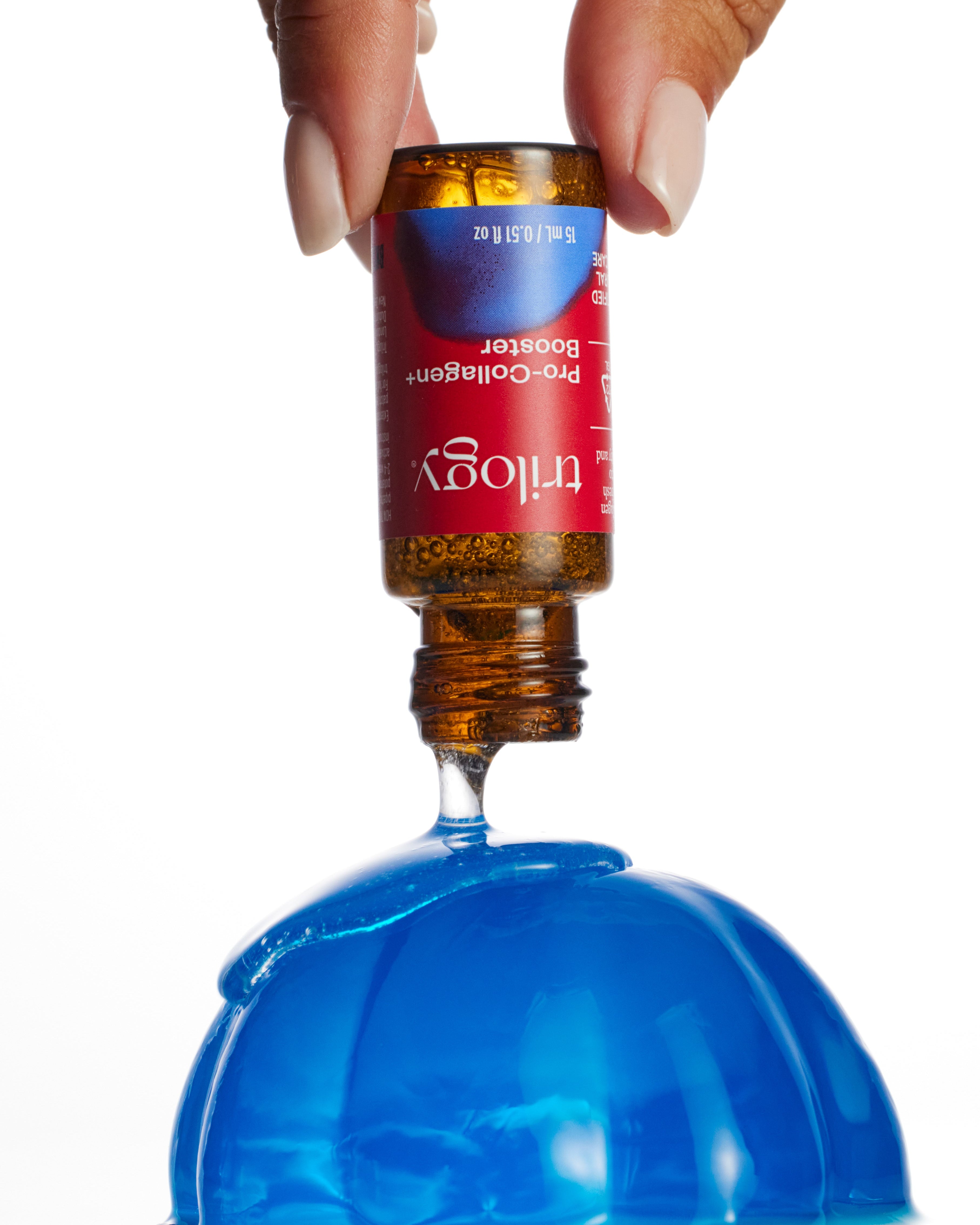 Hand holding a bottle with a blue liquid and a red cap labeled 'Thuggy'.